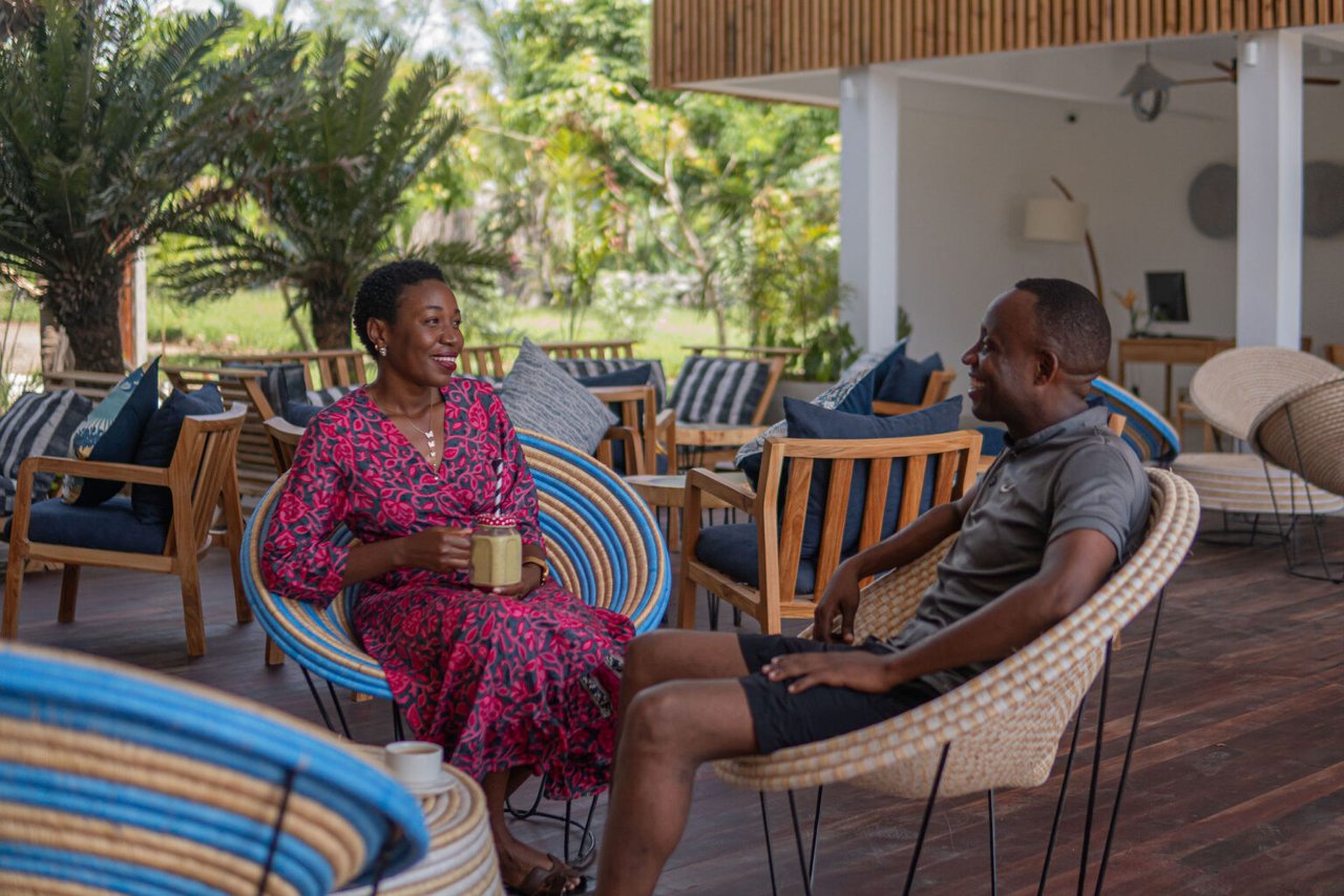 Residents relaxing on a development rooftop lounge
